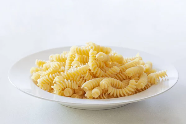 Uncooked Fusilli Pasta Plate Isolated White Background Copy Space Your — Stock Photo, Image