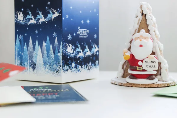 santa cake with gift box and christmas cards