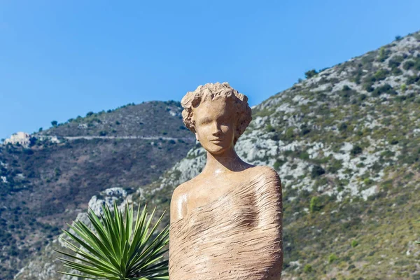 female sculpture in eze village