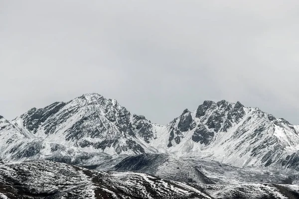 snow on mountain peak in winter