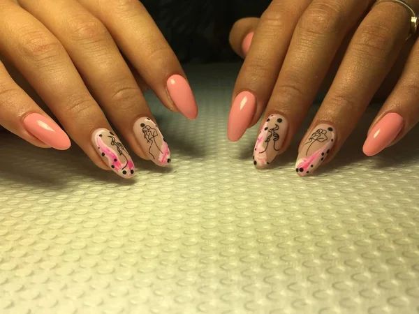 Fashionable pink manicure with a stylish design on long nails — Stock Photo, Image