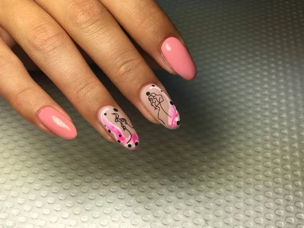 Fashionable pink manicure with a stylish design on long nails — 스톡 사진