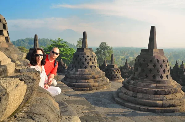 Couple between stupa at Borobudur Temple Indonesia — Stock Photo, Image