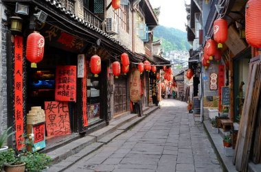 Fenghuang, China - May 15, 2017: The decoration of red lampions on the streets of Fenghuang Ancient Town (Phoenix ancient town). clipart