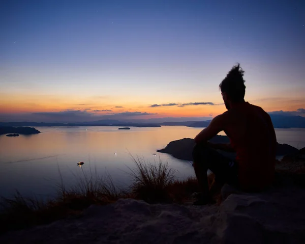 Silhouette Man Sitting Beach Sunset Stock Photo