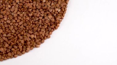 Çeyrek çerçeve şeklinde daire yığın üzerinde kızarmış buğday dönen tablo açın. Beyaz izole. Loopable. Makroyu kapatın. Yukarıda/ek yükü göster.