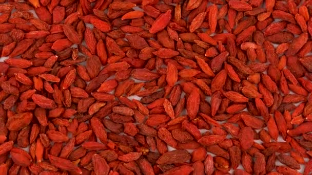 Full frame background of organic dried goji berries rotating on turn table. Loopable. Close up macro. View from above/overhead. — Stock Video