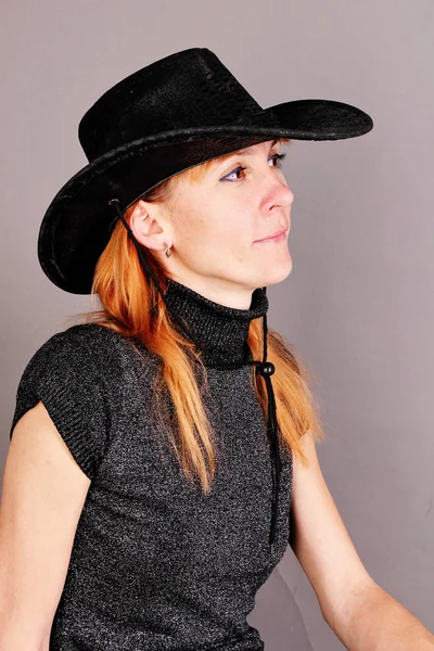 Portrait of red-haired woman in a hat. — Stock Photo, Image