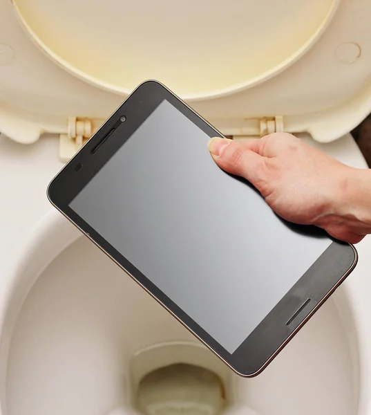 Woman throws the toilet smartphone. — Stock Photo, Image