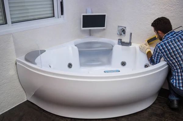 Installation Modern Bath Hot Tub Applying Sealant Bathtub Stock Image