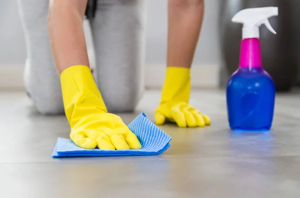 Great concept of domestic cleaning, woman cleaning the floor.