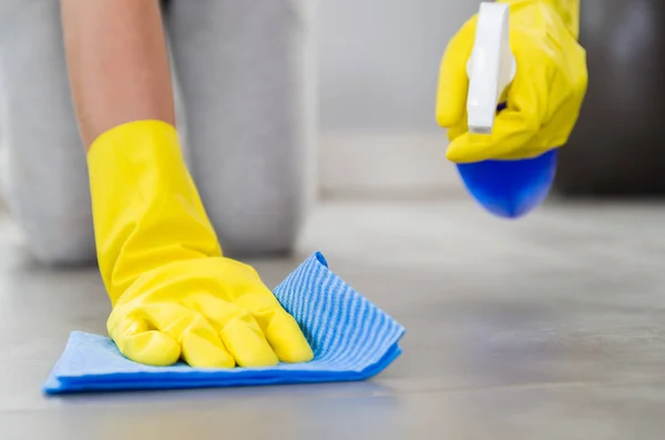 Great concept of domestic cleaning, woman cleaning the floor.