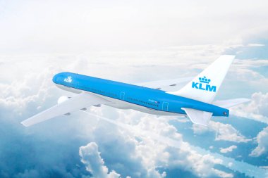 Aerial view of KLM Royal Dutch Airlines Boeing 777 on approach to runway at Schiphol International airport. clipart