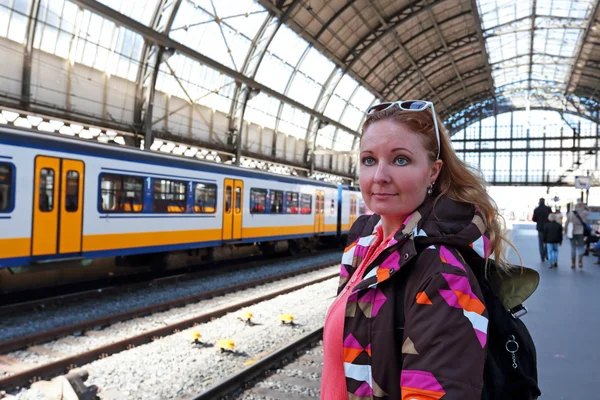 Young native dutch woman waiting for the train at the train stat — Stock Photo, Image