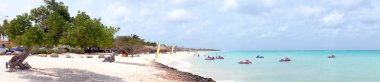 Panorama from eagle beach on Aruba island in the Caribbean sea clipart