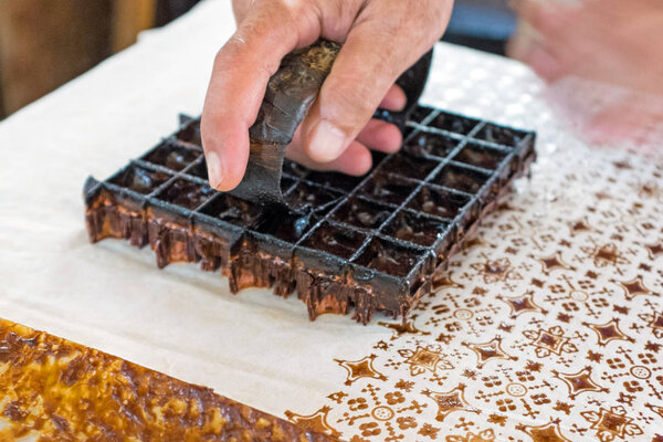 Printing on the fabric to make Batik.