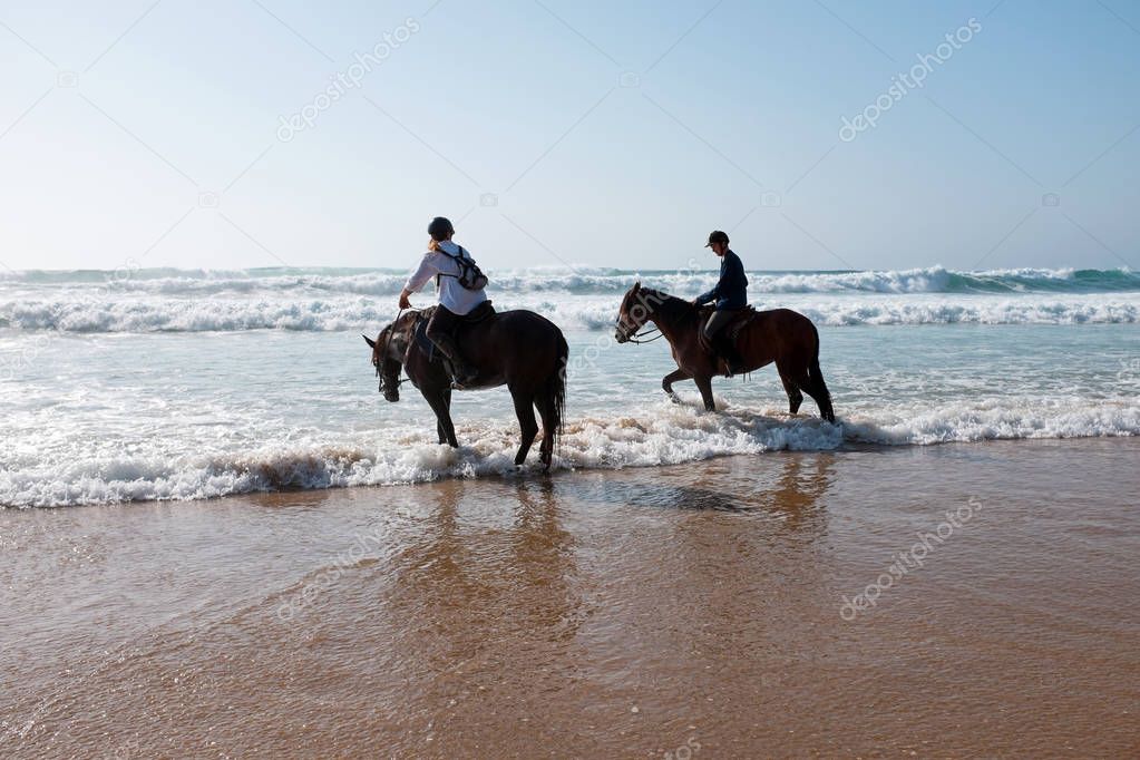 Horse riding in the water from the atlantic ocean