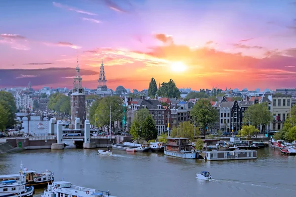 Aerial from the city Amsterdam in the Netherlands at sunset — Stock Photo, Image