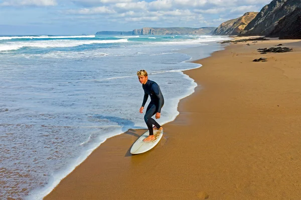 Aerial from a young surfer ready to surf at the atlantic ocean — Stock Photo, Image