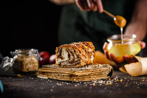 Swirl brioche or traditional Polish babka cake with walnut, apple and honey — Stock Photo, Image