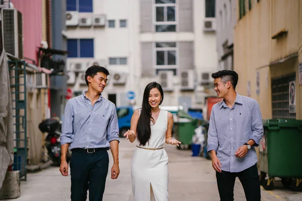 portrait of professional business people  on a street in a city in Asia.