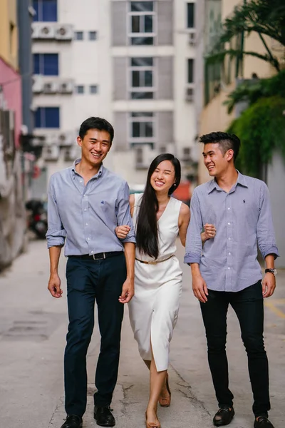 portrait of professional business people  on a street in a city in Asia.