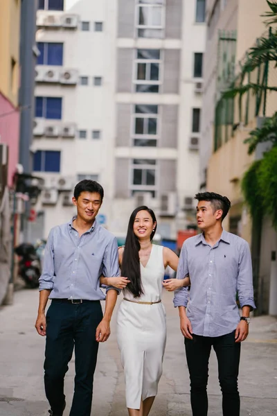 portrait of professional business people  on a street in a city in Asia.