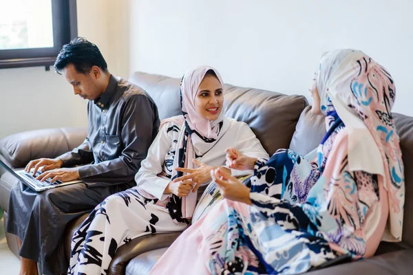 portrait of a Muslim Malay family at home  during the Muslim festival of Hari Raya in Singapore, Asia.