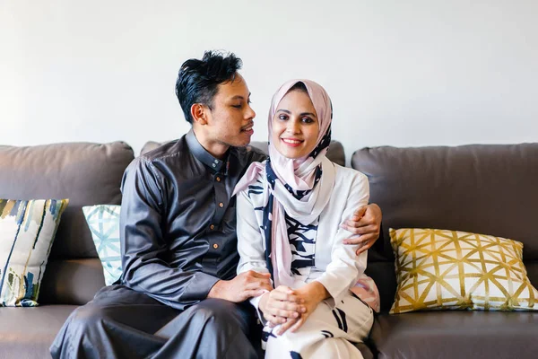 Portrait Of A Muslim Malay Couple At Home During The Muslim Festival Of Hari Raya In Singapore Asia They Are Sitting On Their Home Couch Flat Wife Stock Photo 195399536