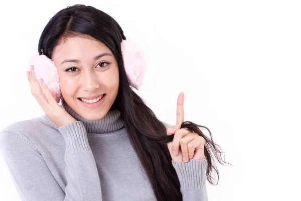Happy, smiling asian-caucasian woman pointing up her finger — Stock Photo, Image