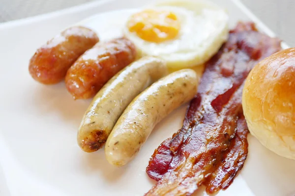 Sausages, bacon and egg, breakfast without healthy vegetable — Stock Photo, Image