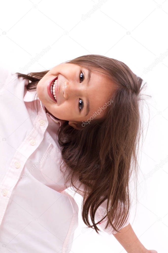 happy, smiling female asian caucasian kid playing