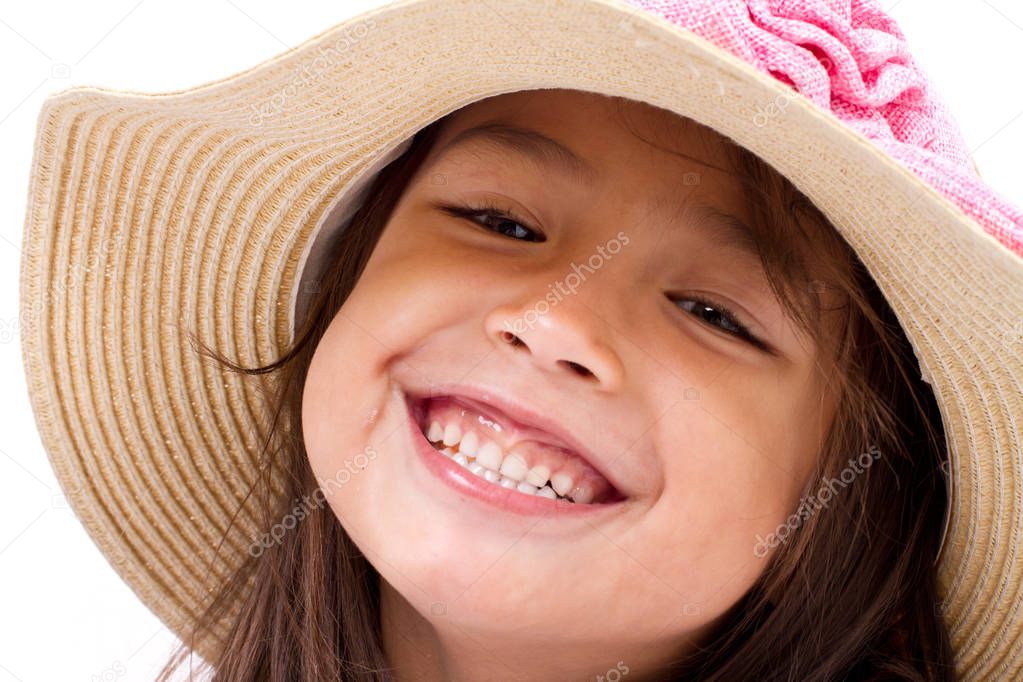 close up face of happy, smiling female asian caucasian kid playi
