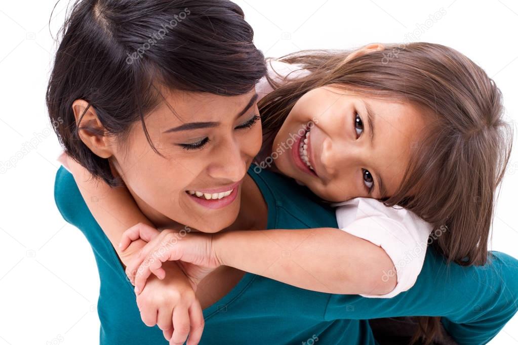 little daughter hugging her mother, concept of happy family love