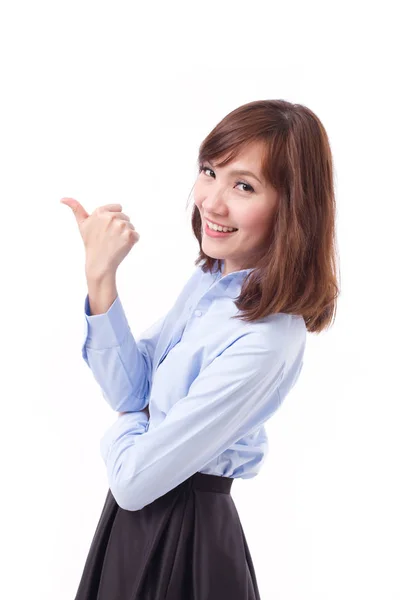 Business woman pointing thumb up at blank space, studio isolated — Stock Photo, Image