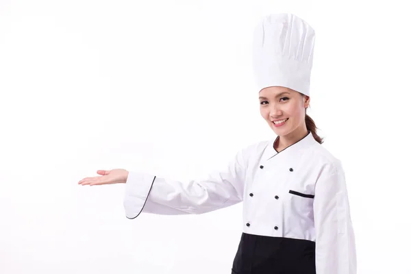 Feliz, sorrindo, chef feminino positivo apontando a mão — Fotografia de Stock