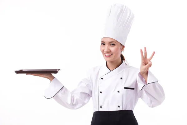 Feliz, sorrindo, chef feminino positivo apontando três dedos — Fotografia de Stock