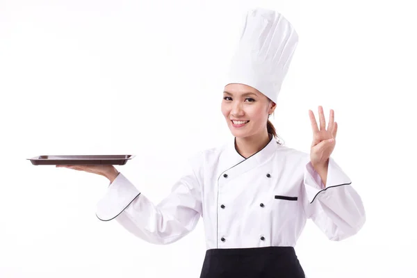 Happy, smiling, positive female chef pointing up four fingers — Stock Photo, Image
