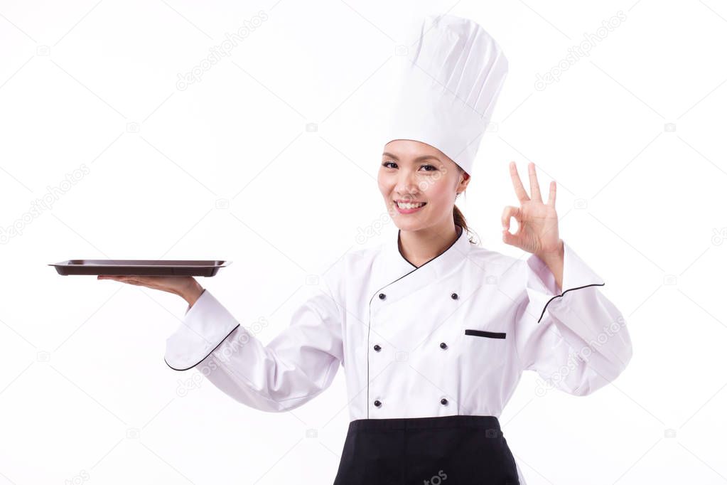 happy, smiling, positive female chef showing ok hand sign