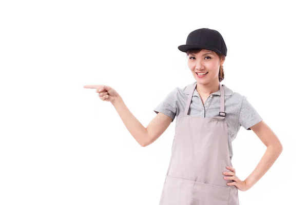 Feliz, trabajadora sonriente apuntando con el dedo hacia arriba — Foto de Stock