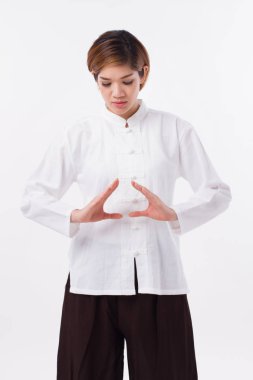 peaceful, strong, confident asian woman practice kungfu qigong, solar plexus concentration clipart