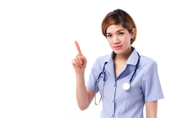 Αυτοπεποίθηση νοσοκόμα δείχνει ένα δάχτυλο μέχρι το κενό διάστημα — Φωτογραφία Αρχείου