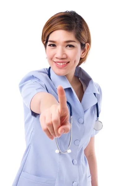 Ευτυχισμένο, χαμογελαστό, θετικό νοσοκόμα, δείχνει ένα δάχτυλο μέχρι σας — Φωτογραφία Αρχείου