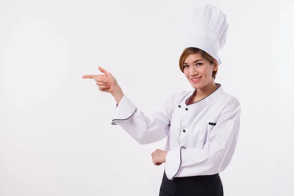 Feminino ásia chef apontando para o lado — Fotografia de Stock