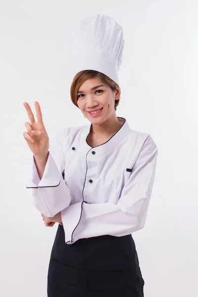 Femmina asiatico chef indicando fino due dita vittoria gesto — Foto Stock