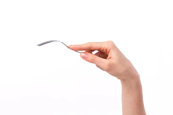Mão segurando garfo, colhendo ou selecionando algo no espaço em branco — Fotografia de Stock