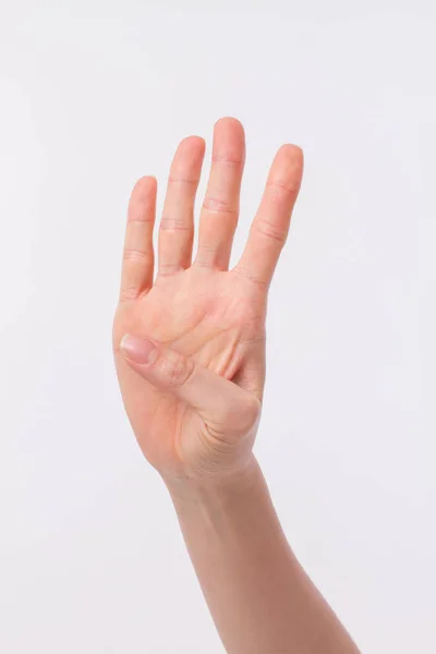 Рука спрямована вгору 4 пальці, студія ізольована — стокове фото