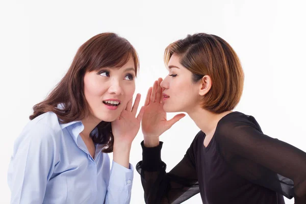 Woman gossiping, whispering, listening to rumor or hearsay Stock Image