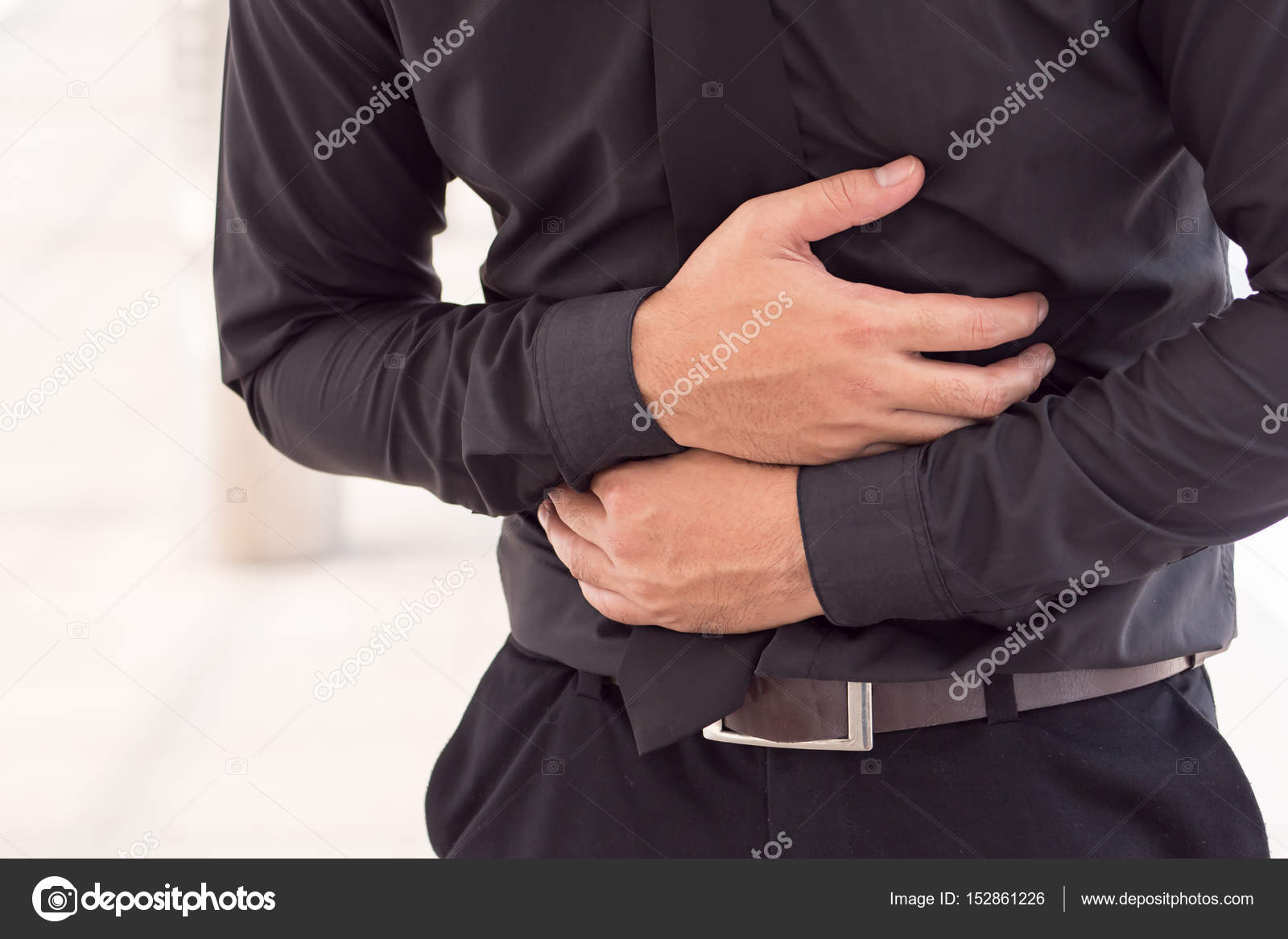 Man suffering from stomach ache, diarrhea, constipation, acid reflux