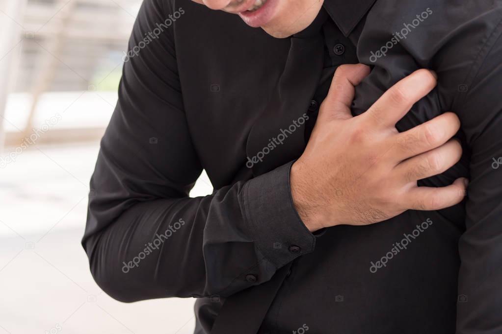 business man suffering heart attack